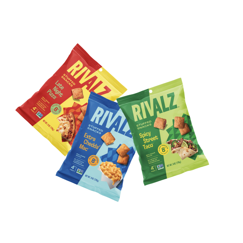 Bags of Late Night Pizza, Spicy Street Taco, Extra Chedda' Mac vegan snacks.  8 grams of protein.