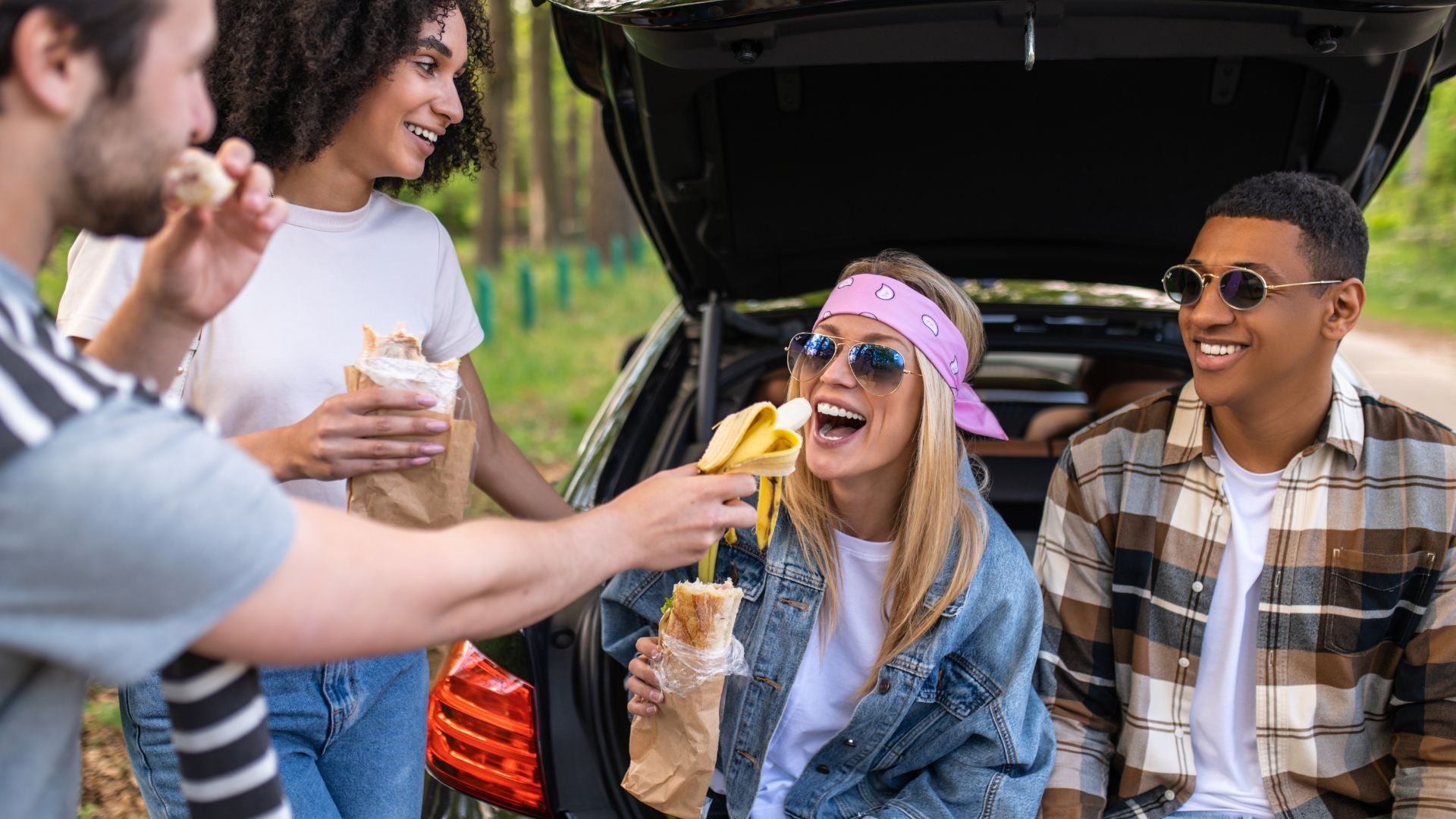 People tailgating. Try these healthy snack swaps. Rivalz plant-based snacks. 